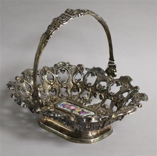 A 19th century Austro-Hungarian pierced white metal basket, the base with inset porcelain plaque, 21.5cm.